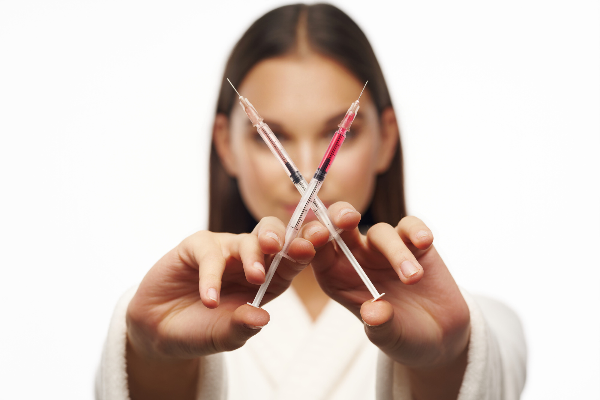 Woman with Two Small Syringes